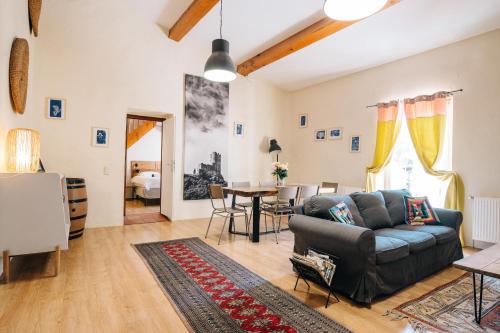 a living room with a couch and a table at Domaine Calmel & Joseph in Montirat