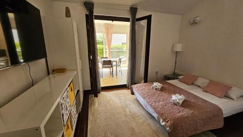 Postel nebo postele na pokoji v ubytování Apartman Hope