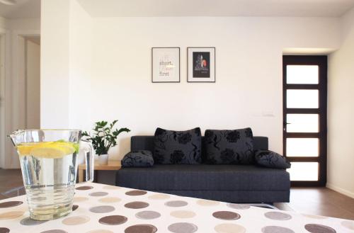 a living room with a table with a glass of lemon at Apartment Vita in Funtana