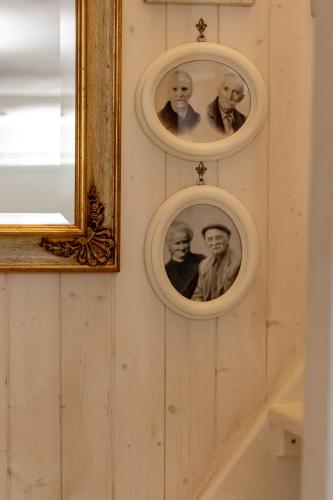 a wall with pictures of three people on it at Emma's House in Sasseta