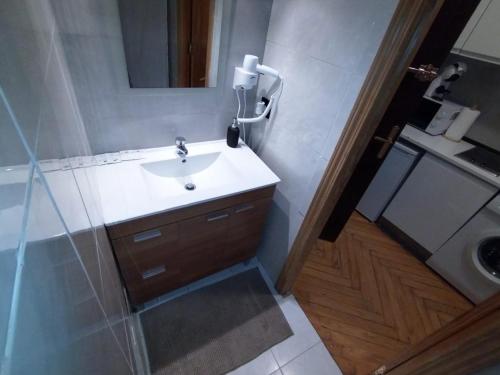 a bathroom with a sink and a mirror at Estudio - Puerta del Sol in Madrid