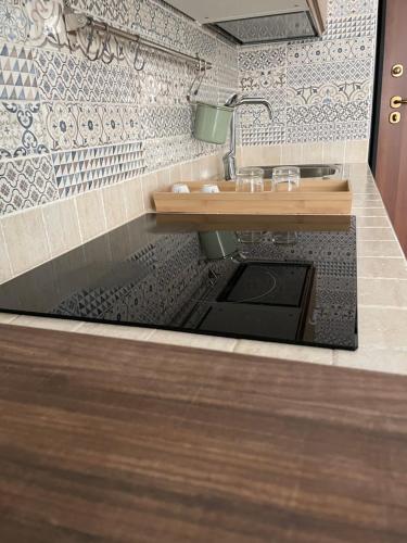 a bathroom with a sink and a counter top at Casa vacanze San Francesco in Barletta