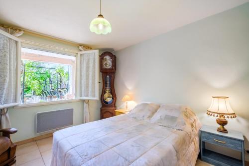 a bedroom with a large bed and a window at Ma Vie Là in Fayence