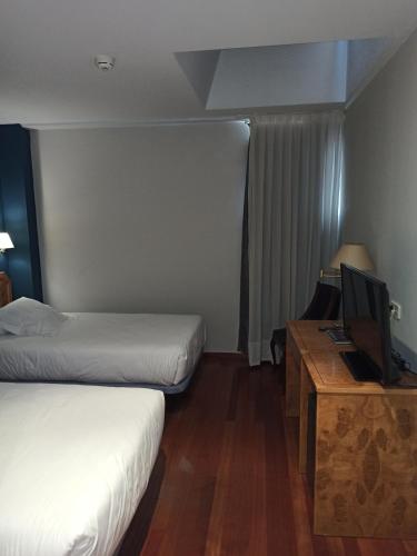 Postel nebo postele na pokoji v ubytování ARVA Spa París