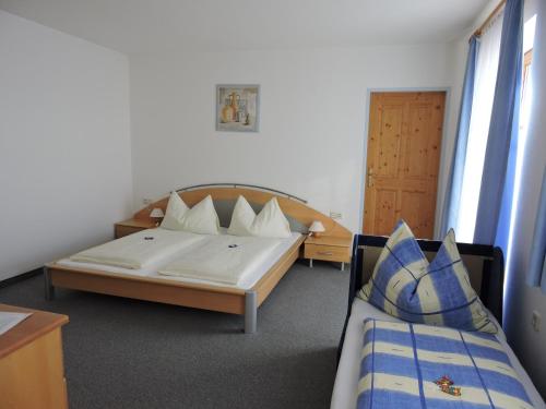 Postel nebo postele na pokoji v ubytování Haus Obermoser