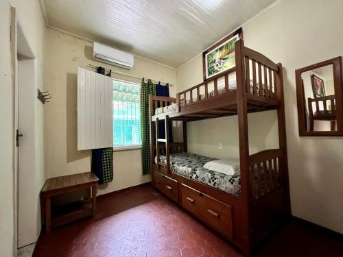 a bedroom with two bunk beds and a window at Hostel Manaus ll in Manaus