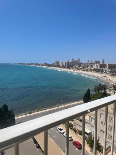a view of the beach from a balcony at Tahiti Dreams in El Campello