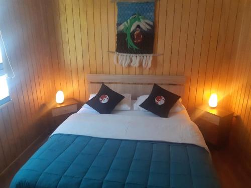 Ein Bett oder Betten in einem Zimmer der Unterkunft cabañas anvi pucon