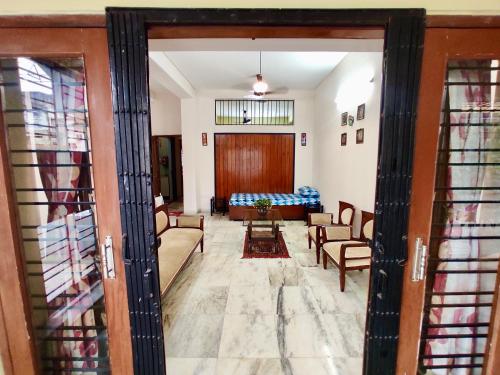 a living room with a couch and a table at Spacious 3BHK House opp South City Mall in Kolkata
