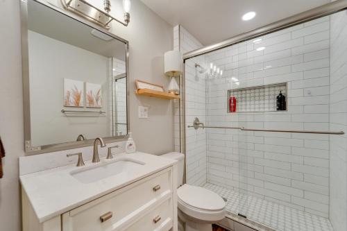 a bathroom with a sink and a toilet and a mirror at Amarillo Vacation Rental with Shared Pool! in Amarillo