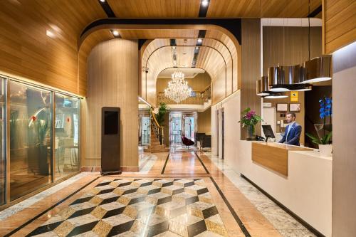 a lobby with a checkered floor in a building at VP Jardín de Recoletos in Madrid