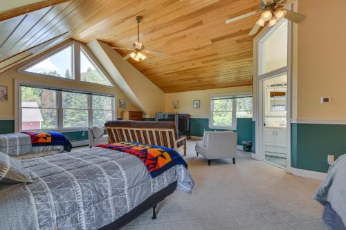 a bedroom with two beds and a ceiling fan at Secluded Calais Getaway Deck, Hot Tub and More! 