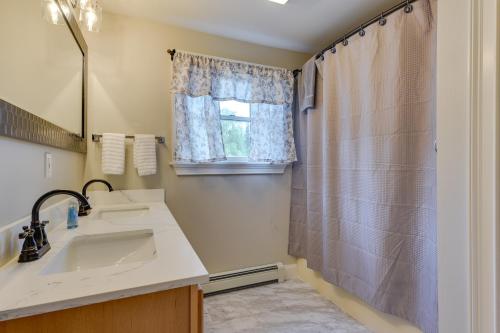 a bathroom with a sink and a shower at Secluded Calais Getaway Deck, Hot Tub and More! 