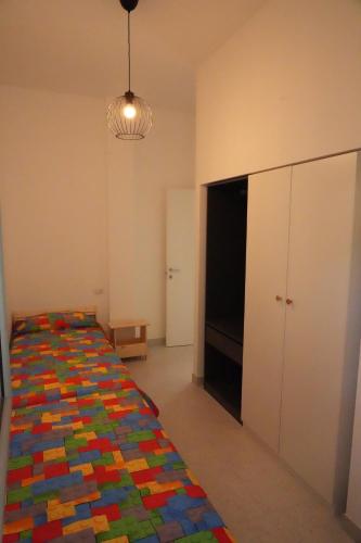 Ένα ή περισσότερα κρεβάτια σε δωμάτιο στο Appartamento AL FARO