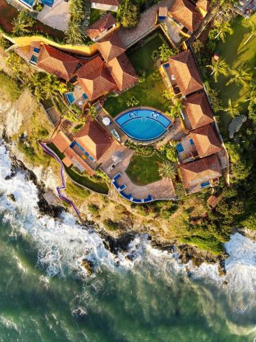 an aerial view of a resort by the ocean at Cala Margarita Hotel in Paraguachi