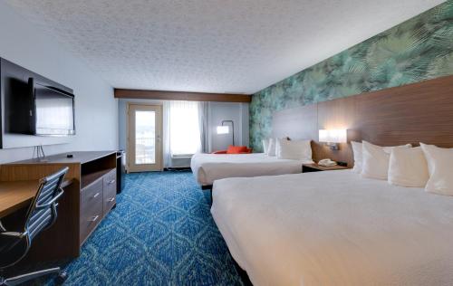 Ένα ή περισσότερα κρεβάτια σε δωμάτιο στο Park Grove Inn
