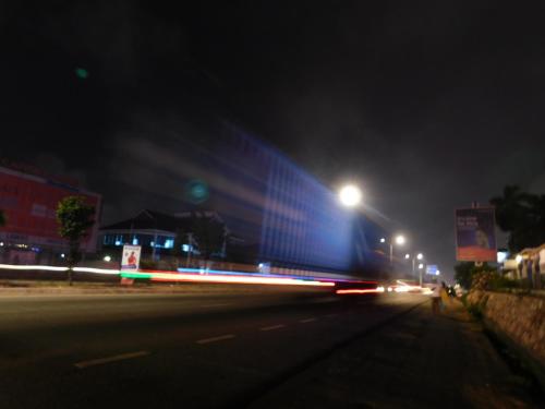 a blurry picture of a street at night at Jesiwa B's Little Palace in Accra