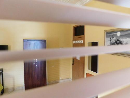a view of a room with a door and a shelf at Jesiwa B's Little Palace in Accra