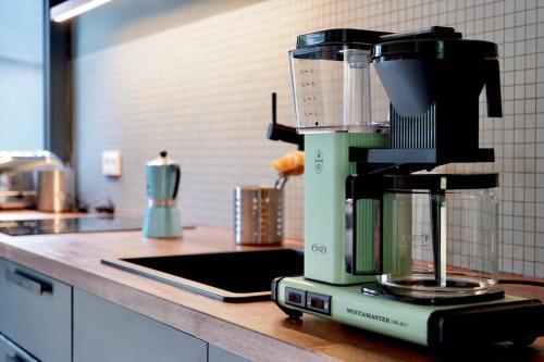 a blender sitting on a counter in a kitchen at Elf am See - Haus 7 in Templin