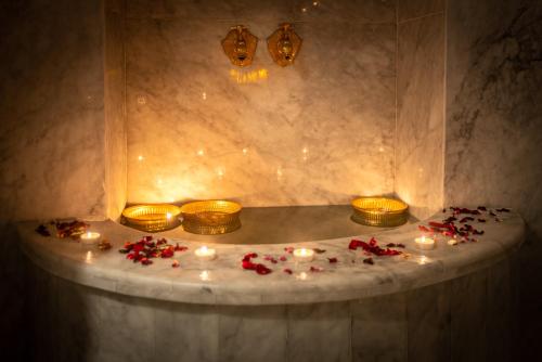 a room with candles and flowers on a table at Palais Aix Kabaj &Spa in Marrakesh