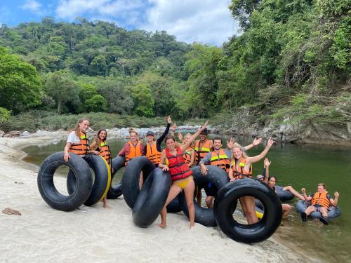 a group of people riding on an inflatable raft in the water at La Ponderosa Reserve in Buritaca
