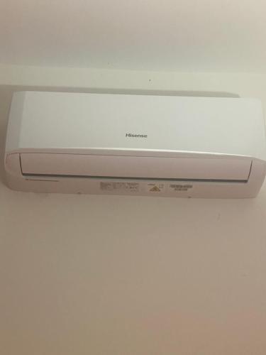 a remote control on top of a white appliance at B&B La Panoramica in Castelmezzano