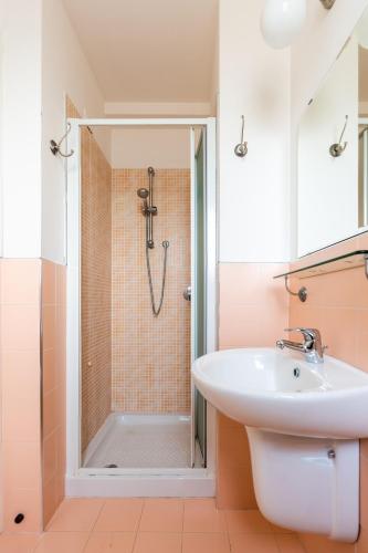a bathroom with a sink and a shower at GG8 Hotel & Suite SPA in Gualdo Tadino