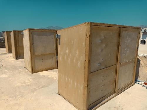 a row of wooden doors sitting on top of a building at Nautilus Capsules in Dahab