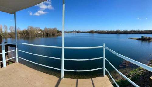 a view from the deck of a boat on a lake at Lake View Lodge Pod in Chichester