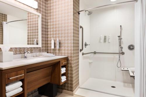 a bathroom with a sink and a shower at Home2 Suites by Hilton Lubbock in Lubbock