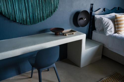 a bedroom with a desk and a chair and a bed at Euforia Retreat and Spa in Eforie Nord