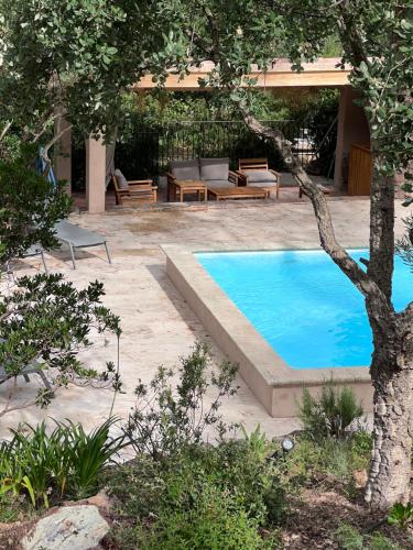 a swimming pool in the middle of a yard at Les Hauts de Diane, CUERS var in Cuers