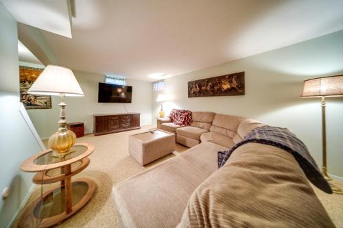 a living room with a couch and a table at Cleveland Area Retreat Near Lake Erie in Richmond Heights