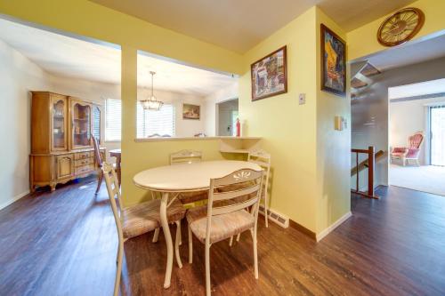 a dining room and kitchen with a table and chairs at Cleveland Area Retreat Near Lake Erie in Richmond Heights