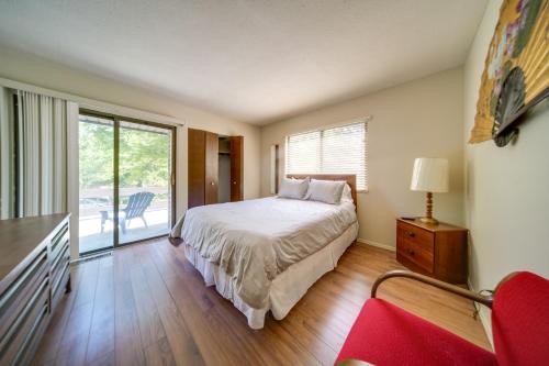a bedroom with a bed and a large window at Cleveland Area Retreat Near Lake Erie in Richmond Heights