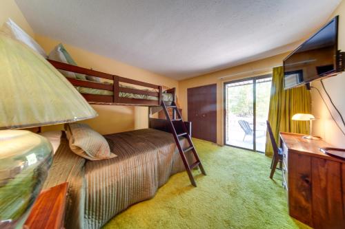 a bedroom with two bunk beds and a desk at Cleveland Area Retreat Near Lake Erie in Richmond Heights