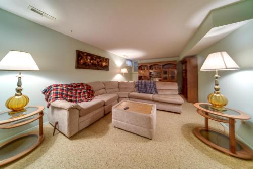 a living room with a couch and two tables at Cleveland Area Retreat Near Lake Erie in Richmond Heights