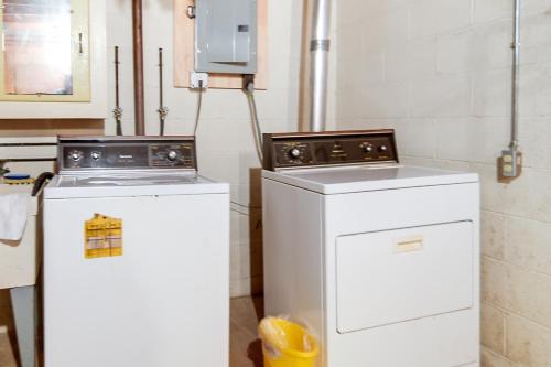 two washing machines sitting next to each other in a kitchen at Cleveland Area Retreat Near Lake Erie in Richmond Heights
