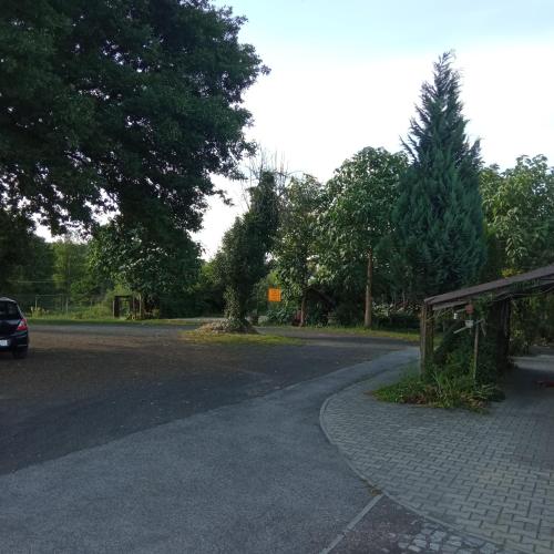 a road with a car driving down the street at Agroturystyka Makowscy in Trzcianka