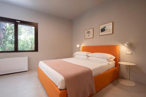 Кровать или кровати в номере Villa Opuntia, Moderna villa vista mare in pineta, Santa Margherita di Pula