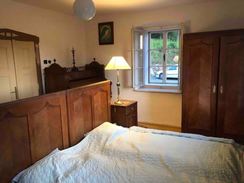 Posteľ alebo postele v izbe v ubytovaní 127 let stará chalupa se spaním na peci