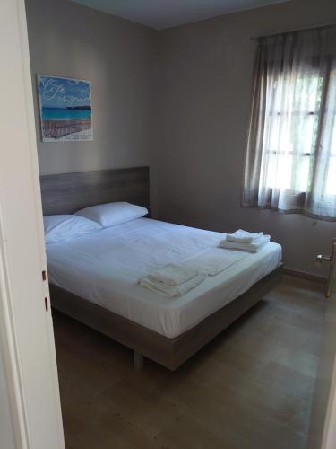 Ένα ή περισσότερα κρεβάτια σε δωμάτιο στο Merida Apartments