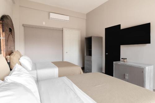 Hotel Rocaval San Cristóbal de las Casasにあるベッド
