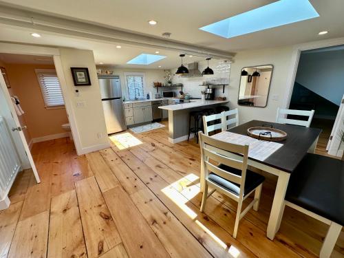 a kitchen and dining room with a table and chairs at Prime Location! Renovated House! 6 Bed4 Bath in Newport