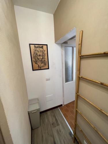 a hallway with a staircase and a room at La bettola di cremia in Cremia