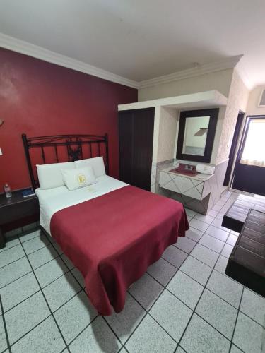 En eller flere senger på et rom på Hotel TorreBlanca