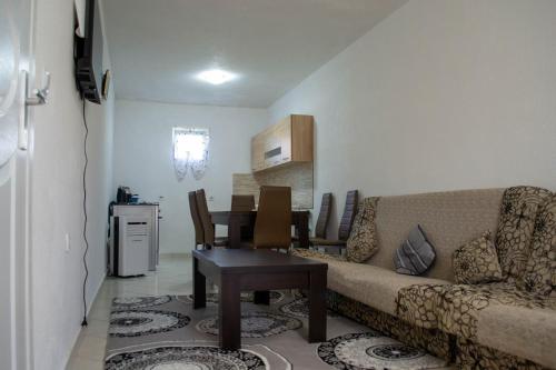 a living room with a couch and a table at Aida Apartments in Ulcinj