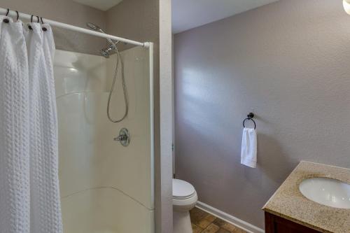 a bathroom with a shower and a toilet and a sink at Searcy Vacation Rental with Deck and Water Views! in Searcy