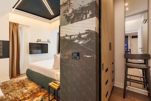 a room with a bed and a room with a ladder at Rosetti One in Constanţa