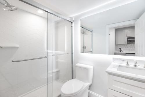 a white bathroom with a toilet and a sink at Westgate Historic Williamsburg Resort in Williamsburg